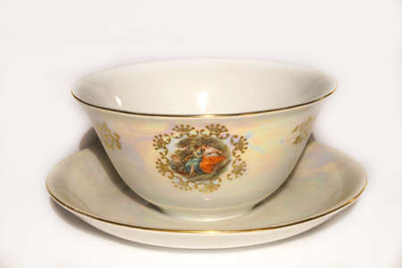 Antique soup plates and saucer made of porcelainの写真素材