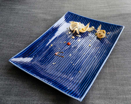 Used dinner plate with leftoversの写真素材