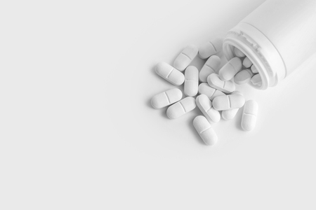 White Pills And Plastic Bottle Containerの写真素材