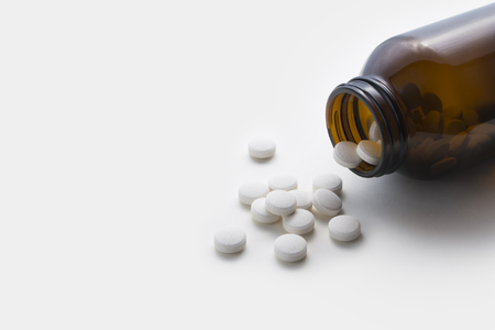 White Pills Medicine In Glass Bottleの写真素材