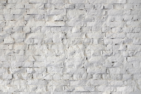 Abstract weathered textured white brick wall backgroundの写真素材