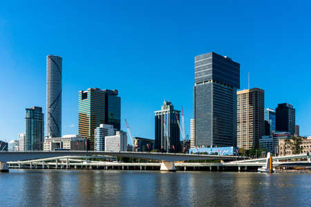 Australia, Brisbane skyline. View from river. Modern skyscrapers of Brisbane city with Brisbane river on the foregroundの写真素材