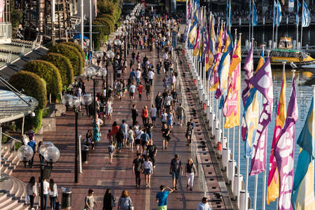 Sydney, Australia - Mar 26, 2016: Aerial view of crowd of people in Darling Harbour. Tourists and...