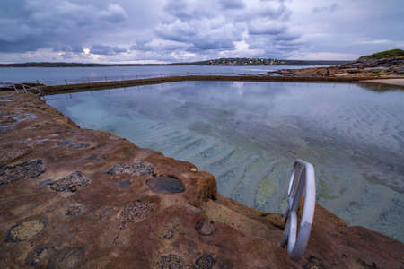 Beautiful rock pool before sunrise, on dusk. Oak park, Cronulla, Australiaの写真素材