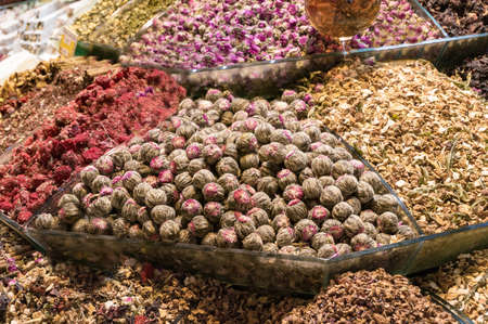 Assortment of herbal blends and scented tea on display on market