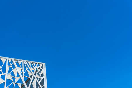 Abstract architecture background of frame structure against clear blue sky on the background. Minimalism urban architecture conceptの写真素材