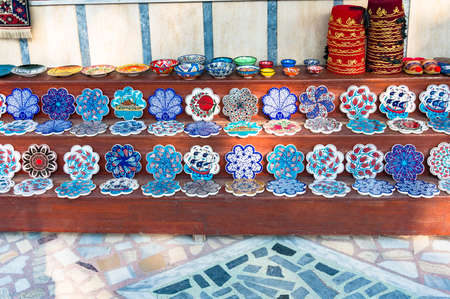 Istanbul, Turkey - August 27, 2013: Colorfull plates and trivets with traditional Turkish floral...