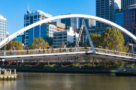 Melbourne, Australia - April 18, 2017: Evan Walker Bridge across Yarra river with people in the morningのeditorial素材
