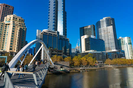 Melbourne, Australia - April 18, 2017: View of Southbank Pedestrian bridge with people and Southbank cityscape on sunny dayのeditorial素材