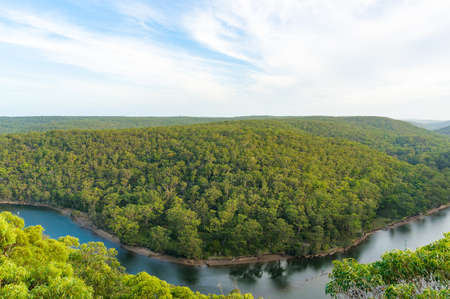 Aerial landscape of beautiful eucalyptus forest and river bend of Hacking river. Bungoona Lookout, Royal National Park, Australiaの写真素材