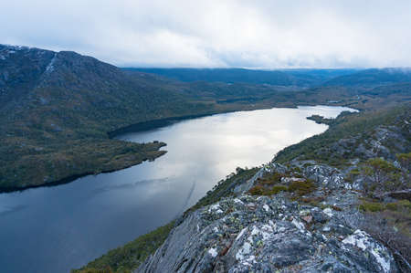 View from above on Dove lake and mountain range at dusk. Cradle Mountain National Park, Tasmania, Australiaの写真素材