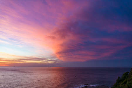 Amazing colorful sunset, sunrise cloudscape above oceanの写真素材