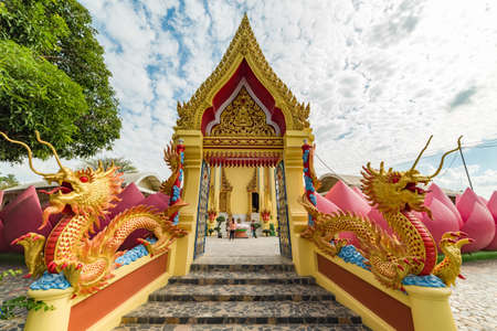Ang Thong, Thailand - December 31, 2015: Colorful Buddhist Temple entrance with dragons, lotus flower and golden decoration. Golden Ubosot, Ordination Hall. Wat Muang Buddhist temple complexのeditorial素材