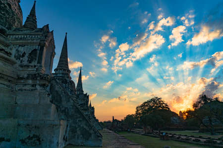 Ancient stupas and ruins of Wat Phra Si Sanphet temple at sunrise with spectacular colorful sky. Ayutthaya Historical Park, UNESCO World Heritage Site. Ayutthaya, Thailandの写真素材