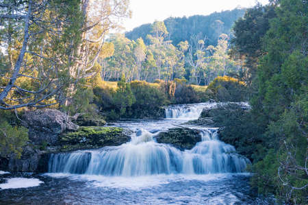 Landscape with beautiful cascade waterfall in forestの写真素材