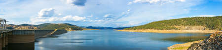 Beautiful panorama landscape of lake and dam surrounded by hills and mountains on sunny day. Wyangala Dam, NSW, Australiaの写真素材