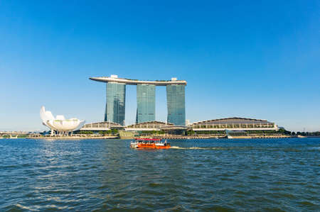 Singapore, Singapore - October 4, 2013: Duck Tour amphibious boat and Marina Bay Sands on sunny dayのeditorial素材
