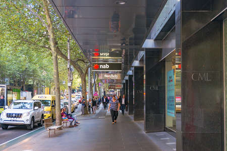 Melbourne, Australia - April 4, 2017: Collins street in Melbourne CBD with NAB branch, Henry Bucks and HCF signs along the street visibleのeditorial素材