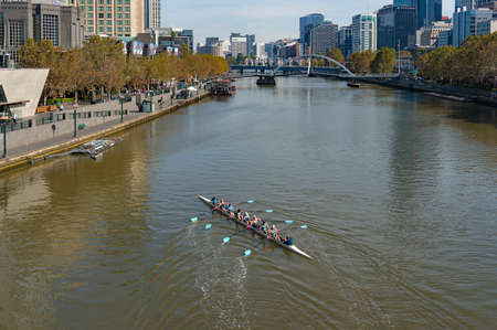 Melbourne, Australia - April 19, 2017: People rowing on Yarra river in the morning with view of Southbank promenadeのeditorial素材