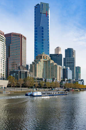Melbourne, Australia - April 20, 2017: Melbourne river cruises boat with Eureka tower and Melbourne cityscape on the backgroundのeditorial素材