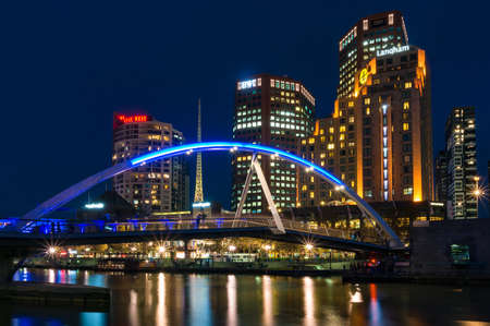Melbourne, Australia - April 20, 2017: Southbank pedestrian bridge across Yarra river and Melbourne citysccape at nightのeditorial素材