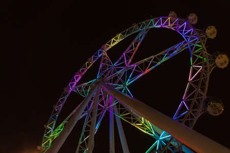 Melbourne, Australia - April 20, 2017: Colorful illuminated Melbourne Star, Melbourne Eye observation wheel at nightのeditorial素材