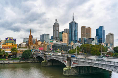 Melbourne, Australia - April 21, 2017: Melbourne CBD, Central Business District view with historic Princes Bridge over Yarra river on rainy dayのeditorial素材