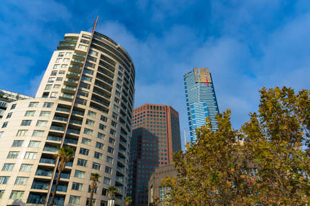 Looking up at tall modern skyscraper buildings. Contemporary architecture backgroundのeditorial素材