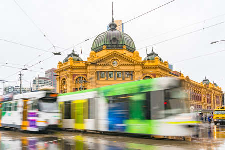 Melbourne, Australia - April 21, 2017: Trams driving in front of Flinders street stationのeditorial素材