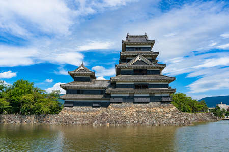 Matsumoto castle with pond on sunny day. Matsumoto, Japanの写真素材