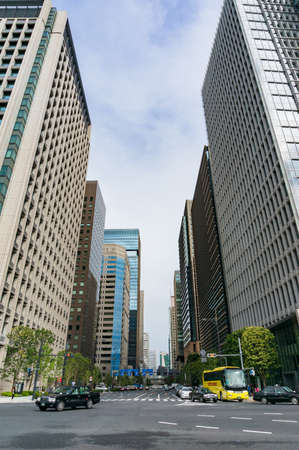 Tokyo, Japan - August 30, 2016: Urban street near Imperial Palace gardens in Tokyo. Modern Asian megalopolis city lifeのeditorial素材