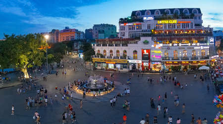 Hanoi, Vietnam - August 12, 2017: Hanoi city square with fountain with people walking and ejoying the eveningのeditorial素材