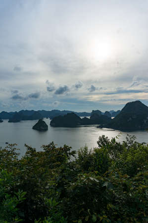 Halong bay mountain islands landscape at dusk. Ha Long Bay popular tourist attraction and tourism spot in Vietnamの写真素材