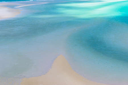 Aerial view of tropical beach with clear turquoise water and white sand. Tropical paradise, beach...