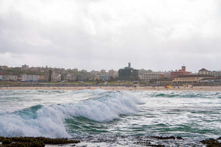 Ocean wave with Bondi Beach on the background. Popular tourist destination backgroundの写真素材