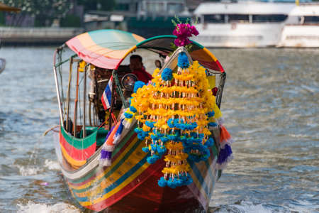 Bangkok, Thailand - January 3, 2016: Traditional Thai passenger boat decorated with bright flowers and garlandsのeditorial素材