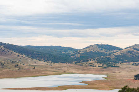 Australian outback landscape with lake and mountains in the distance. Nature backgroundの写真素材