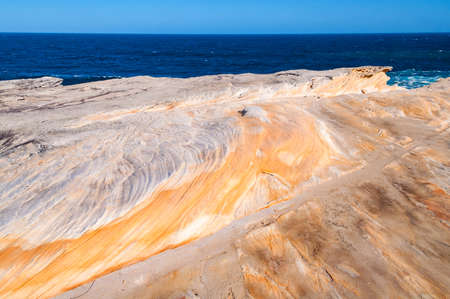 Picturesque rock surface and sea view. Nature background, texture