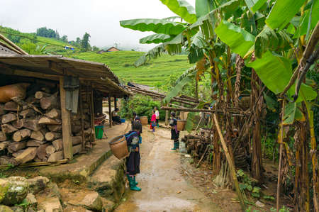 SaPa, Vietnam - August 16, 2017: Authentic Vietnamese village with local women guidesのeditorial素材