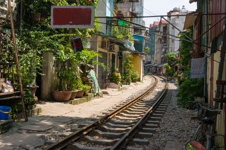 Hanoi, Vietnam - August 21, 2017: Railway track going through Hanoi urban district close to housesのeditorial素材