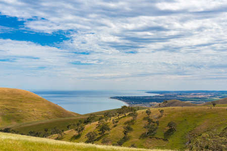 Countryside landscape of picturesque hills and sea, ocean in the distance. South Australiaの写真素材