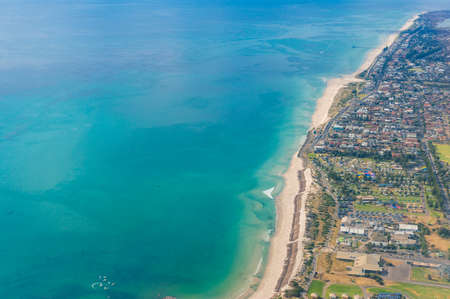 Aerial view of beautiful ocean coastline with sandy beaches and waterfront property. Glenelg, Adelaide, South Australiaの写真素材