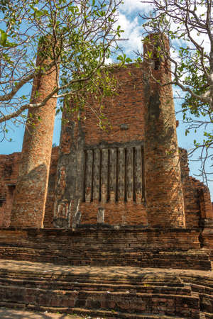Ancient ruins of Wat Thammikarat temple with old red brick walls and columns. International landmark, travel backgroundの写真素材