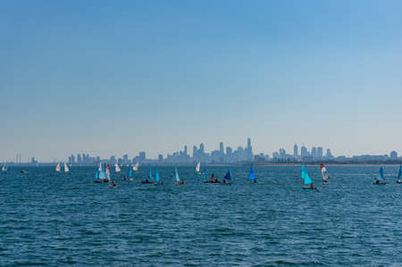 Melbourne, Australia - April 6, 2017: Sailing club training with Melbourne cityscape on the backgroundのeditorial素材