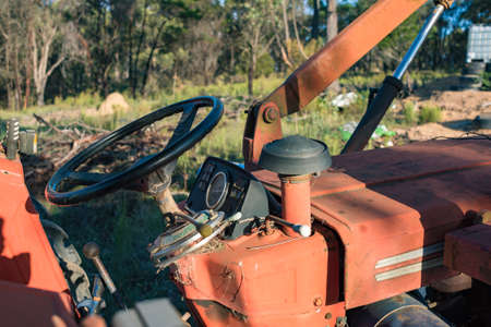 Agricultural machinery with steering wheel, orange bulldozer drivers placeの写真素材