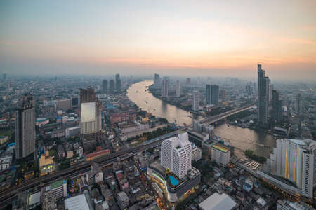 Aerial view of Bangkok cityscape and Chao Praya river at dusk. Bangkok, Thailand
