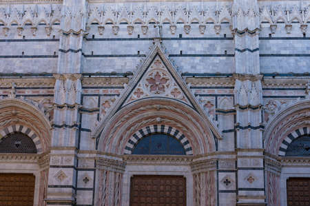 Siena Cathedral facade with ornate walls and windows, Italian historic architectureのeditorial素材