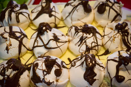 Meringue dessert decorated with chocolate. Dessert mealの写真素材