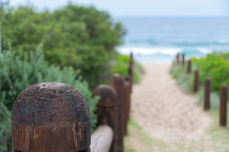 Wooden poles to beach entrance. Summer seaside vacation, holiday backgroundの写真素材