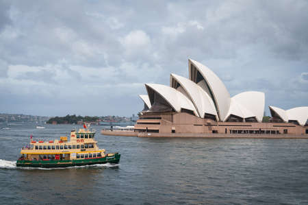 Sydney, Australia - February 02, 2013: Sydney transport ferry on a ride in Sydney Harbour with Sydney Opera House on the background. NSW public transport infrastructureのeditorial素材